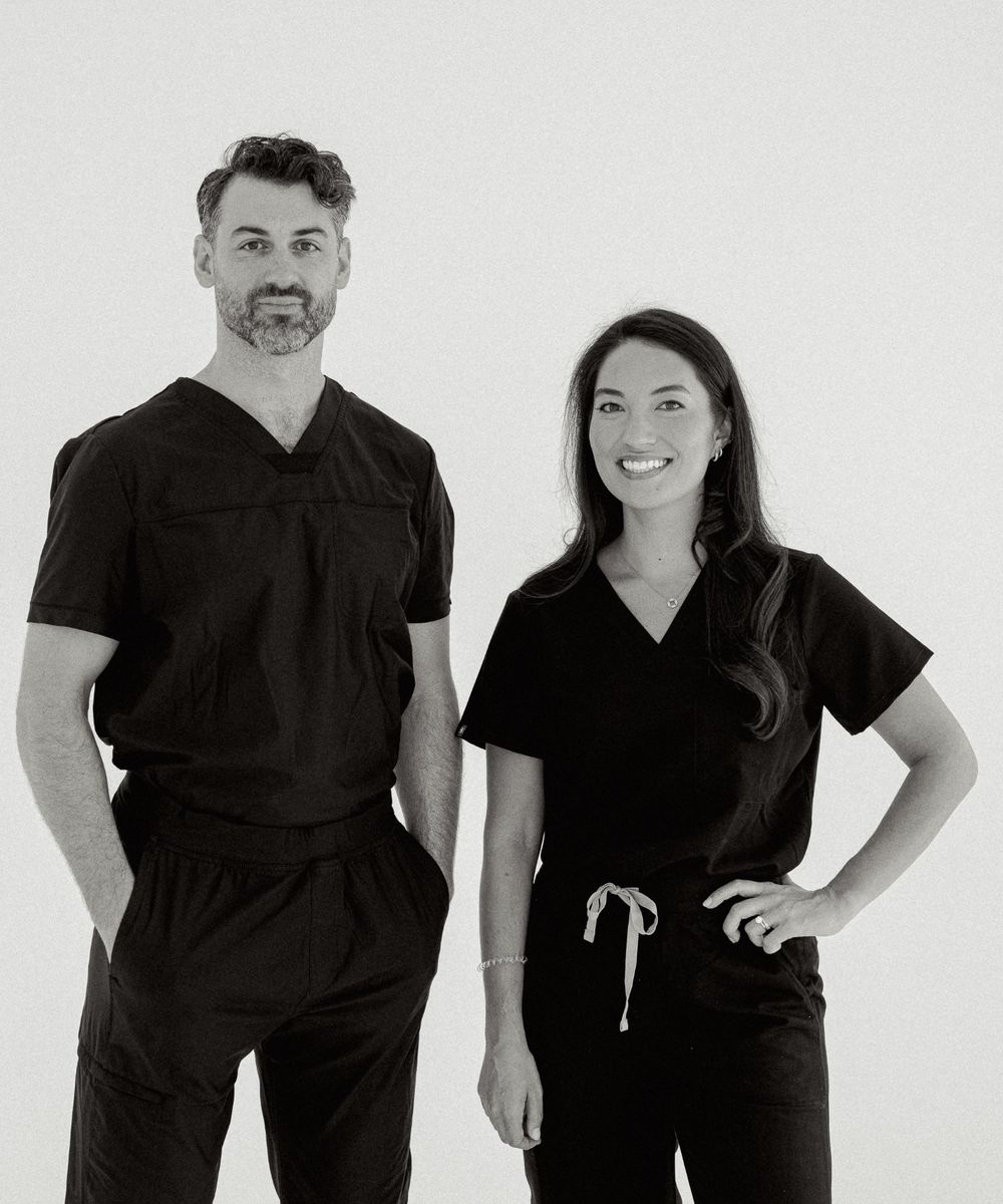 Dr. Benjamin Subtelny and his wife in surgical scrubs